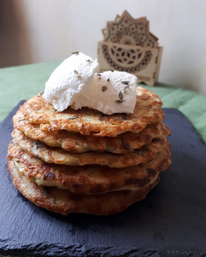 Potato pancakes topped using salty cream cheese
